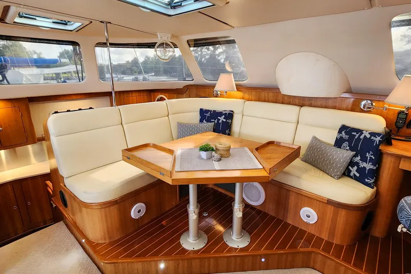 Slide: The Image of Luxurious interior of 2007 Antares Catamarans PDQ 44i with elegant seating and wooden accents. - 23