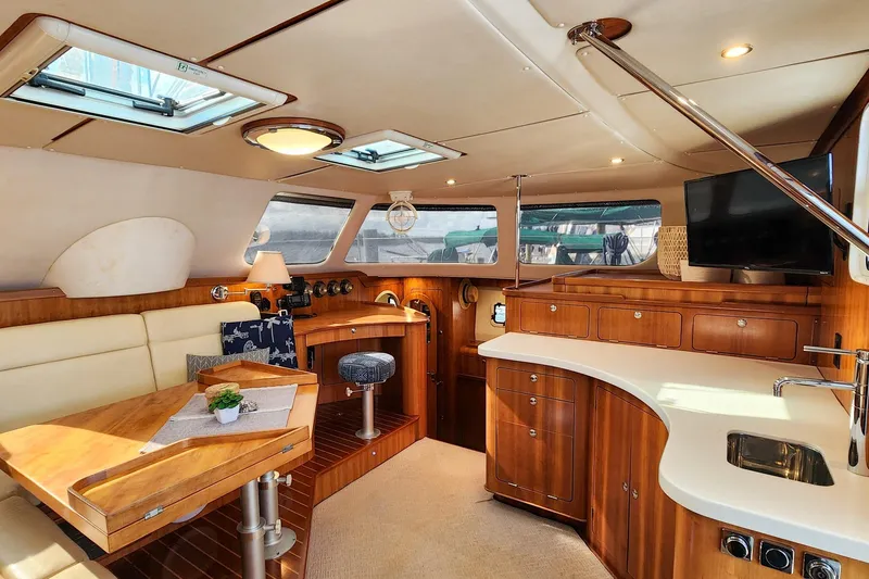 Slide: The Image of Luxurious interior of 2007 Antares Catamarans PDQ 44i with wood finish and modern amenities. - 24