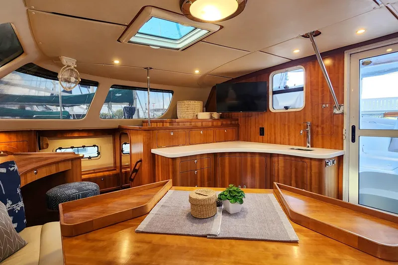 Slide: The Image of Luxurious 2007 Antares Catamarans PDQ 44i interior with wood finish and modern amenities. - 25