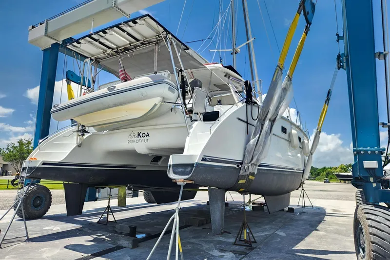 Slide: The Image of 2007 Antares Catamarans PDQ 44i on lift, Park City, UT, sunny day. - 5