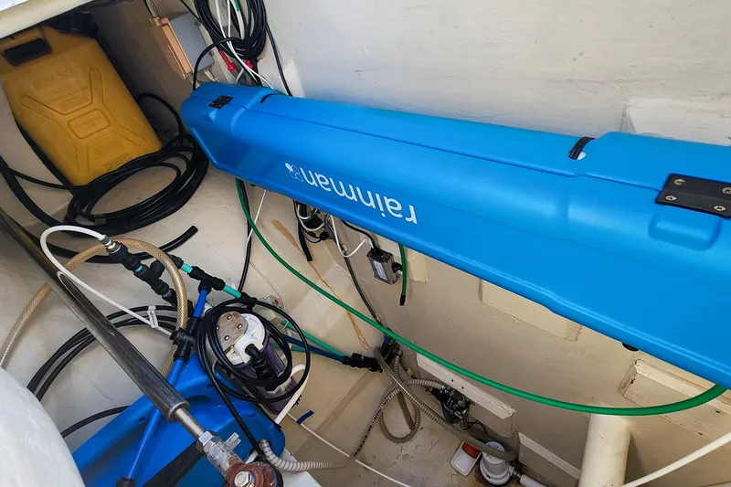 Slide: The Image of 2007 Antares Catamarans PDQ 44i engine room with Rainman watermaker and various cables. - 50