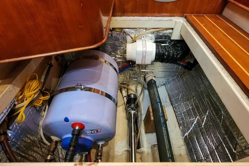Slide: The Image of Engine compartment of 2007 Antares Catamarans PDQ 44i with water heater and insulated walls. - 55