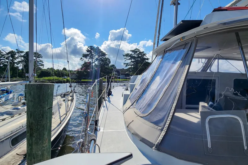 Slide: The Image of 2007 Antares Catamarans PDQ 44i docked, sunny day, clear skies, marina view. - 7
