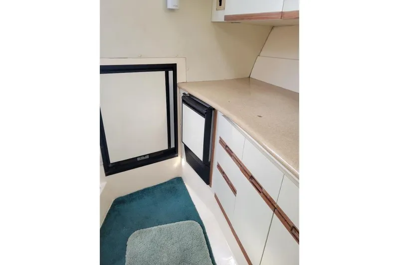 Slide: The Image of Interior of 1996 Phoenix 34 Tournament boat with countertop and cabinetry. - 10
