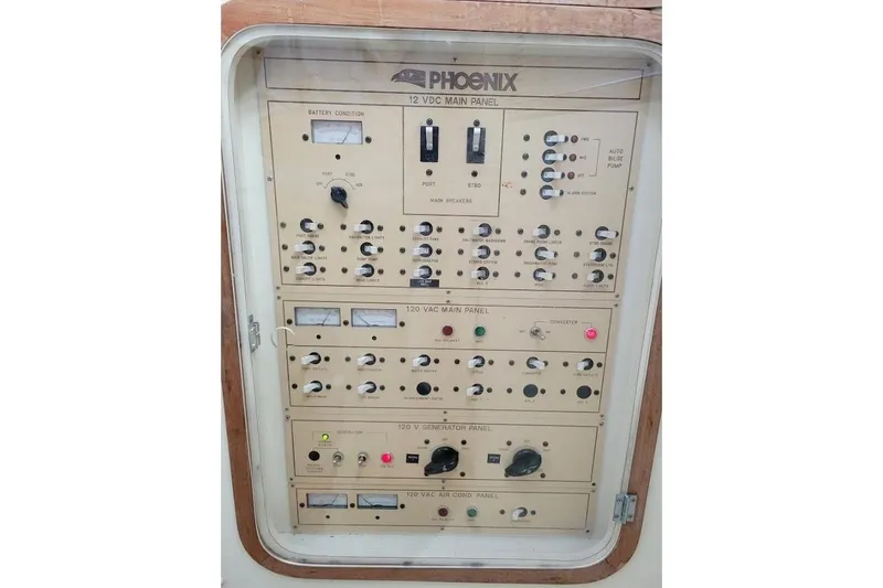 Slide: The Image of Electrical control panel of a 1996 Phoenix 34 Tournament boat, featuring various switches and meters. - 16