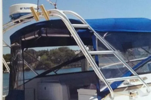 Slide: The Image of 1996 Phoenix 34 Tournament boat with blue canopy and radar equipment. - 25