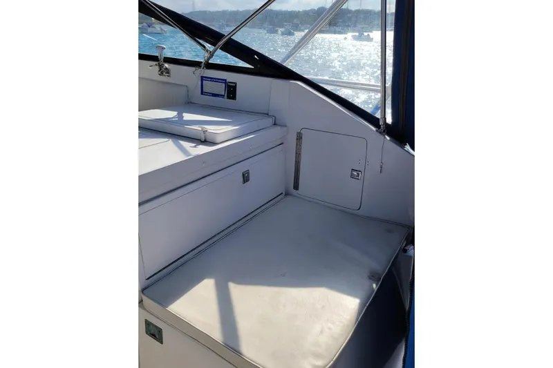 Slide: The Image of Interior of 1996 Phoenix 34 Tournament boat with seating and storage. - 33