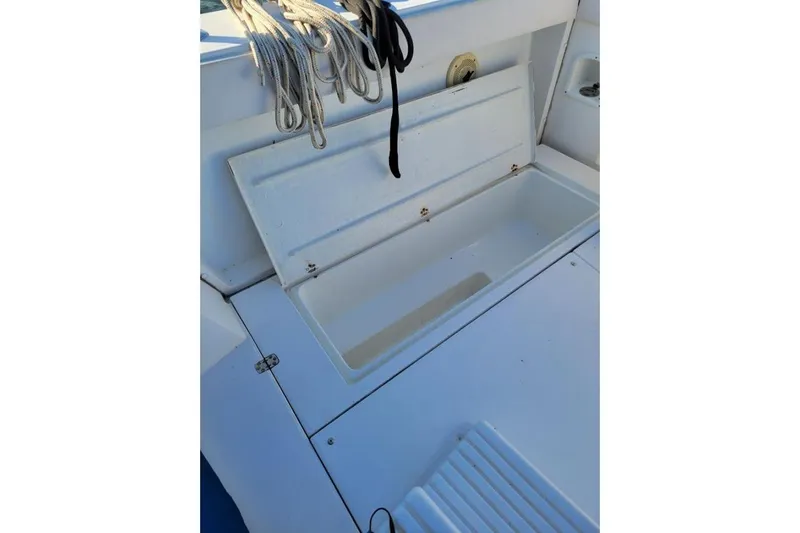 Slide: The Image of Open storage compartment on 1996 Phoenix 34 Tournament boat deck. - 36