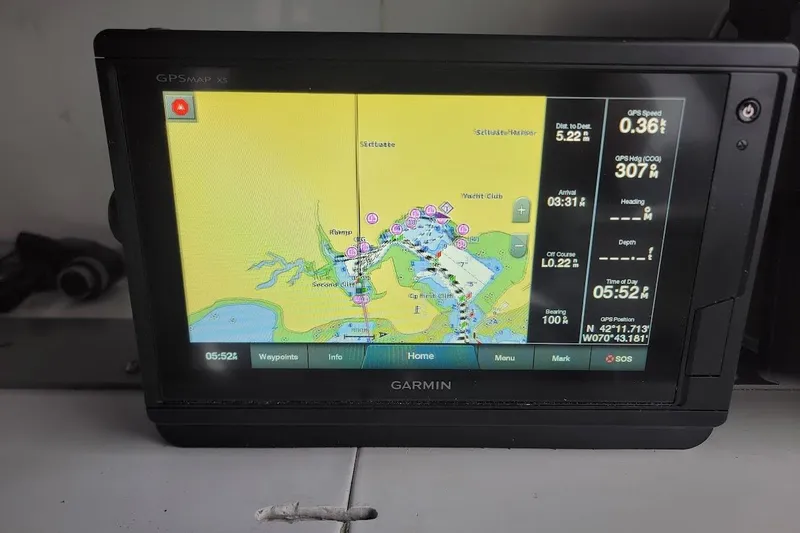 Slide: The Image of Garmin GPS display on 1996 Phoenix 34 Tournament boat, showing navigation map and data. - 5