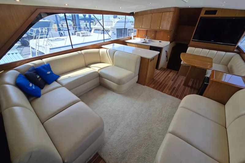 Slide: The Image of Luxurious interior of 1986 Ocean Yachts 55 Super Sport with plush seating and modern amenities. - 12