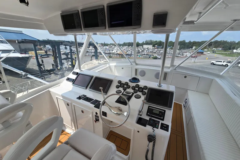 Slide: The Image of Cockpit of 1986 Ocean Yachts 55 Super Sport with modern navigation equipment. - 41
