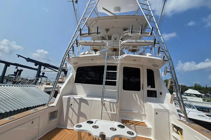 Slide: The Image of 1986 Ocean Yachts 55 Super Sport, rear view with ladder and fishing setup. - 50