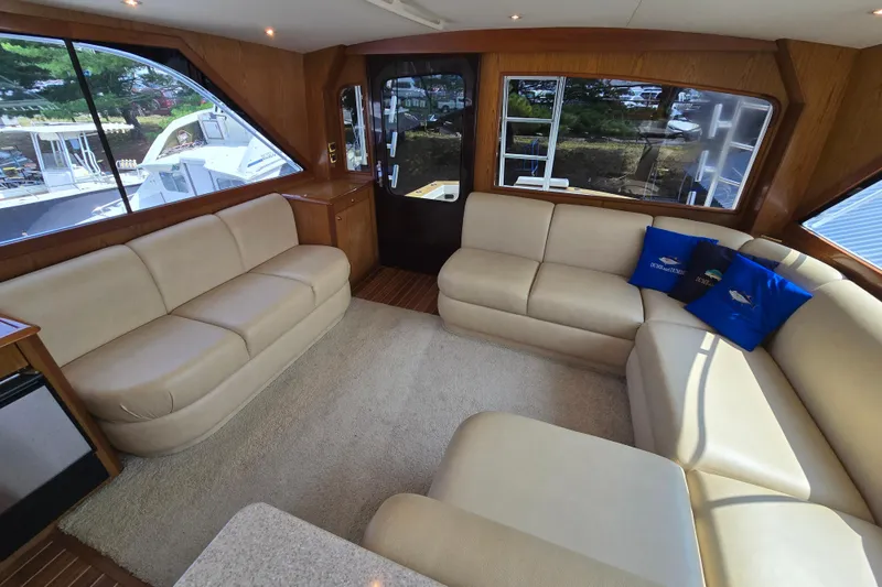 Slide: The Image of Luxurious interior of 1986 Ocean Yachts 55 Super Sport with beige leather seating. - 11