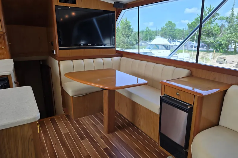 Slide: The Image of Luxurious interior of 1986 Ocean Yachts 55 Super Sport with seating and large window view. - 19