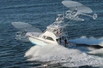 Slide: The Image of 1986 Ocean Yachts 55 Super Sport cruising swiftly on open water. - 2