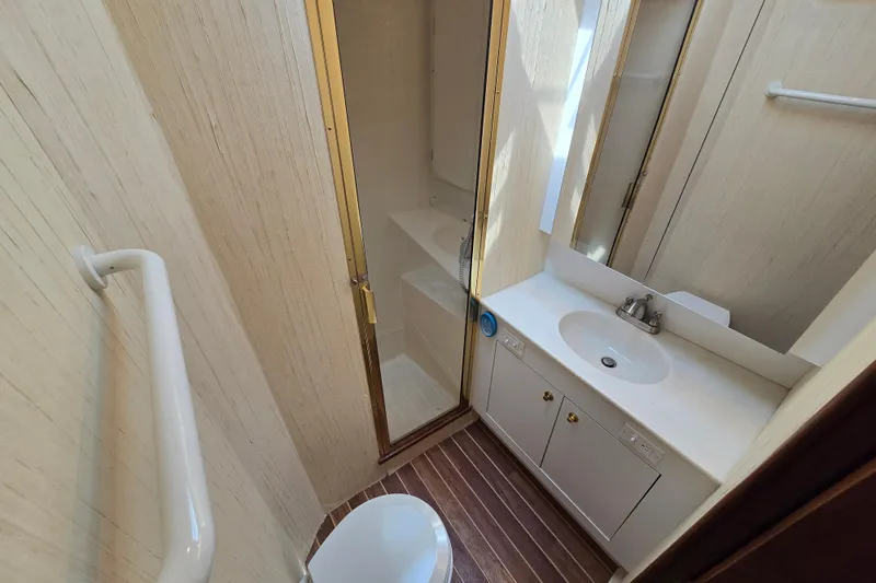 Slide: The Image of Bathroom interior of 1986 Ocean Yachts 55 Super Sport with shower and sink. - 26