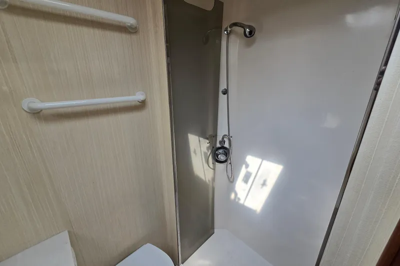 Slide: The Image of Shower area in 1986 Ocean Yachts 55 Super Sport, featuring sleek design and modern fixtures. - 32