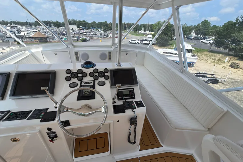 Slide: The Image of Cockpit of 1986 Ocean Yachts 55 Super Sport with steering wheel and navigation instruments. - 40