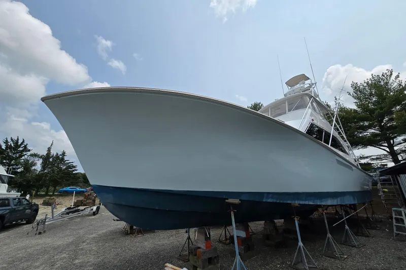 Slide: The Image of 1986 Ocean Yachts 55 Super Sport on dry dock, showcasing sleek design and sturdy build. - 5