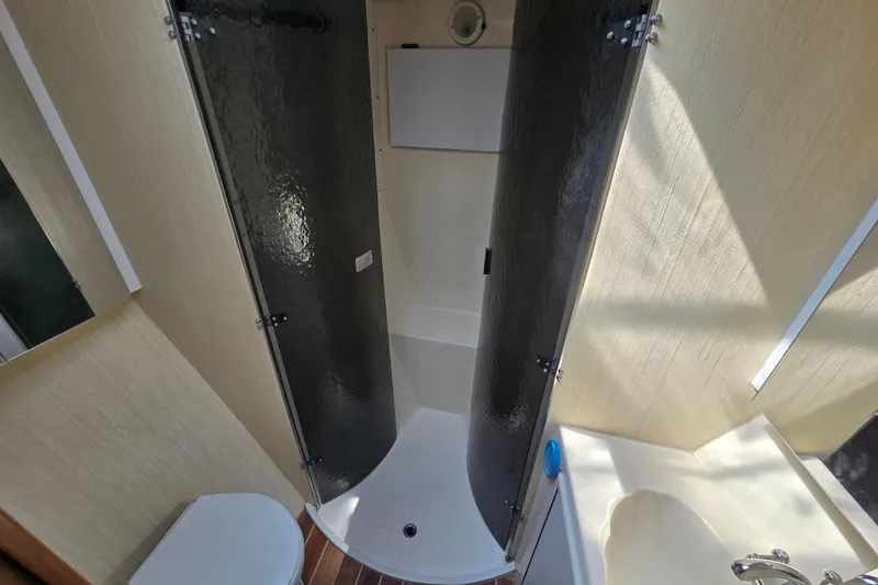 Slide: The Image of Bathroom interior of 1986 Ocean Yachts 55 Super Sport with shower and sink. - 37