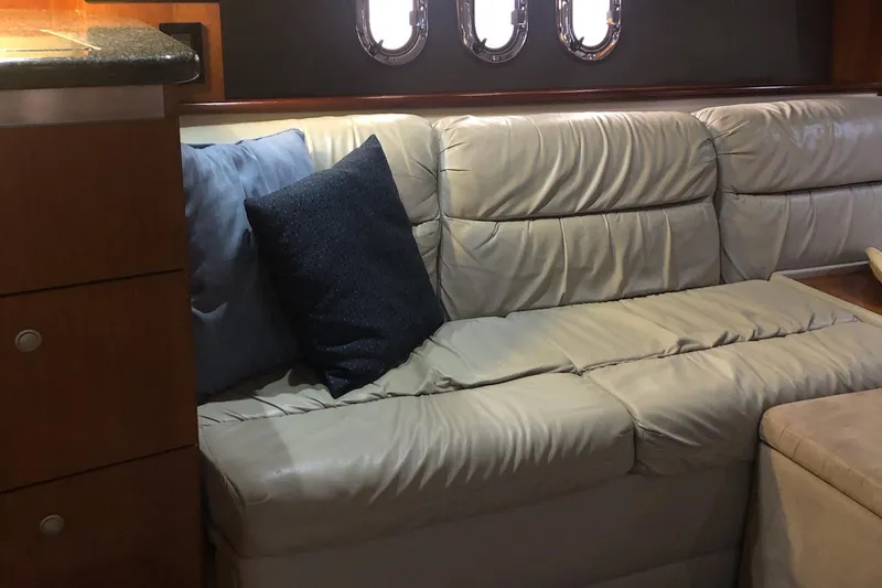 Slide: The Image of Luxurious interior of 2006 Cruisers Yachts 420 Express with leather seating and cushions. - 13