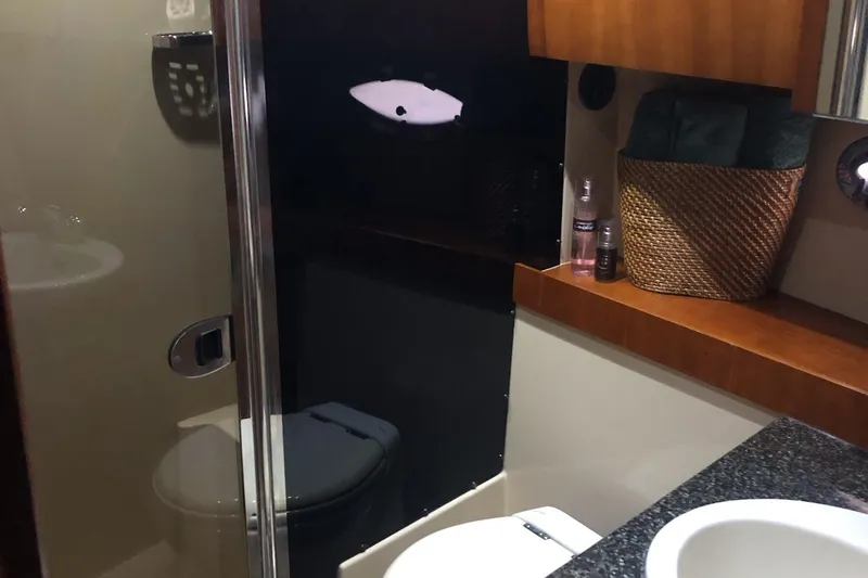 Slide: The Image of Luxurious bathroom in 2006 Cruisers Yachts 420 Express with modern amenities. - 15