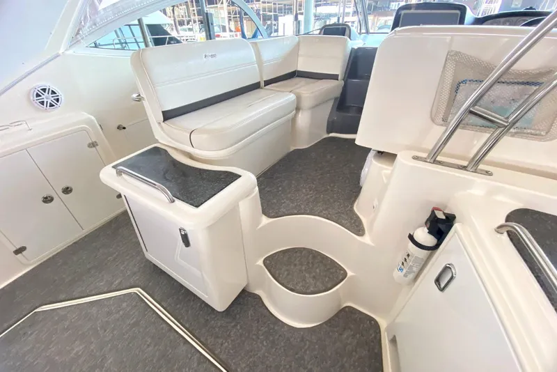 Slide: The Image of 2006 Cruisers Yachts 420 Express interior with seating and storage compartments. - 24