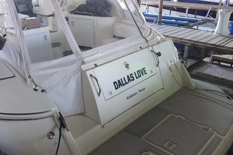 Slide: The Image of 2006 Cruisers Yachts 420 Express docked, featuring "Dallas Love" nameplate, Addison, Texas. - 3