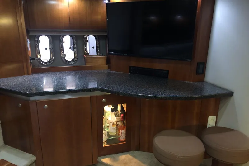 Slide: The Image of Luxurious interior of 2006 Cruisers Yachts 420 Express with granite countertop and TV. - 39