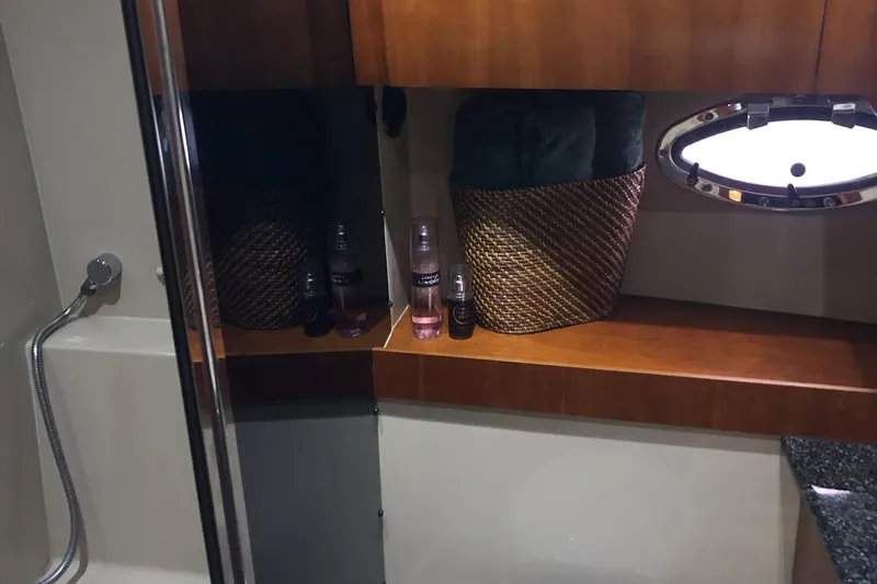 Slide: The Image of Bathroom interior of 2006 Cruisers Yachts 420 Express with shower and storage basket. - 41