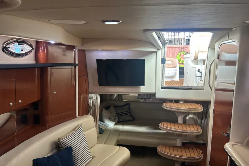 Slide: The Image of Interior of 2005 Sea Ray 340 Sundancer yacht with modern amenities and elegant design. - 14