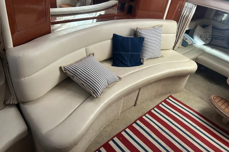Slide: The Image of Luxurious interior of 2005 Sea Ray 340 Sundancer with curved seating and striped cushions. - 15