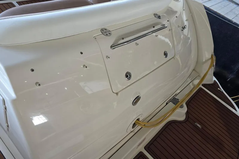 Slide: The Image of 2005 Sea Ray 340 Sundancer boat stern with teak deck and storage compartment. - 31