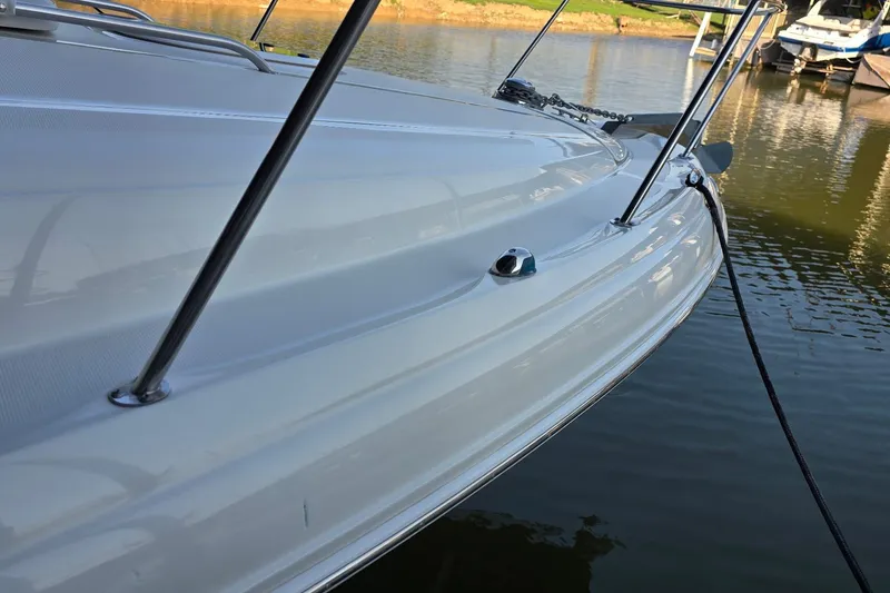 Slide: The Image of 2005 Sea Ray 340 Sundancer boat docked on calm water. - 32