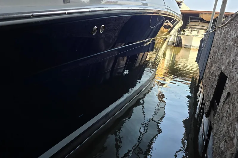 Slide: The Image of 2005 Sea Ray 340 Sundancer yacht docked in narrow marina passage. - 34