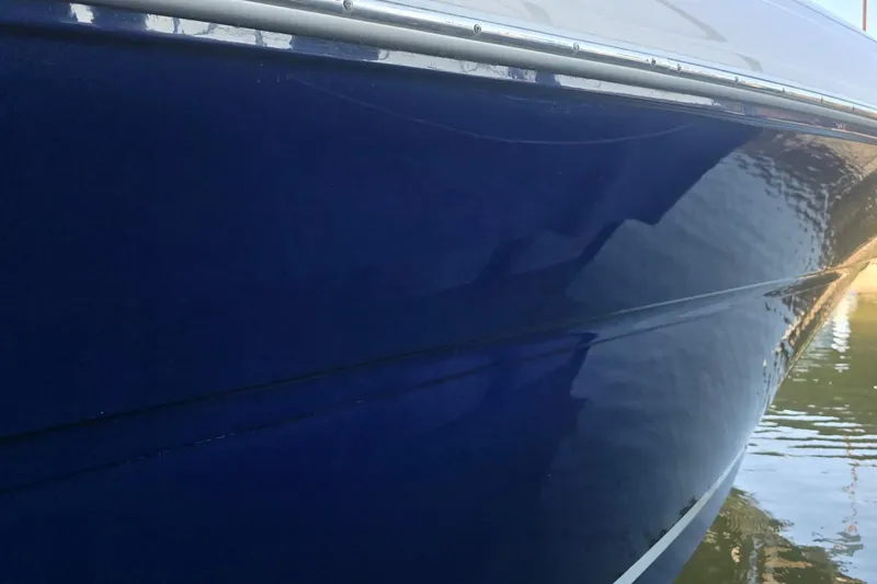 Slide: The Image of Close-up of a 2005 Sea Ray 340 Sundancer boat hull in water. - 36