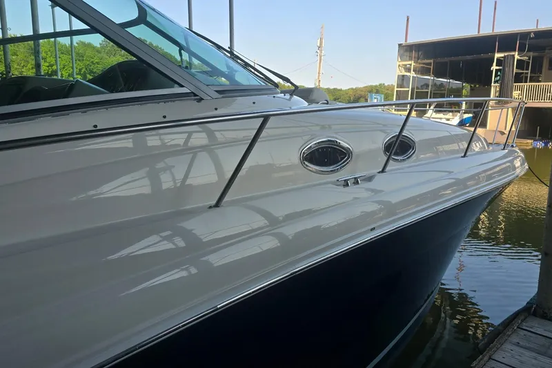 Slide: The Image of 2005 Sea Ray 340 Sundancer docked, showcasing sleek design and polished exterior. - 38