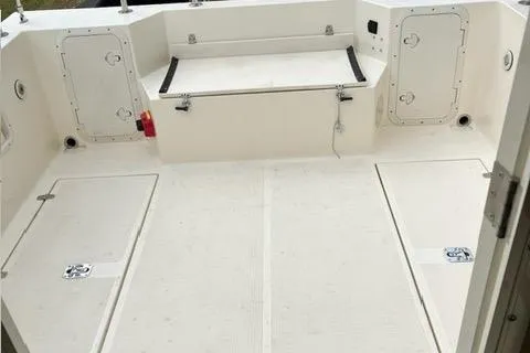 Slide: The Image of 2007 C-Dory Tomcat 255 Pilothouse boat deck with storage compartments. - 12