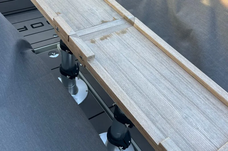 Slide: The Image of 2023 Saxdor 320 GTO interior with wooden table and gray seating. - 14