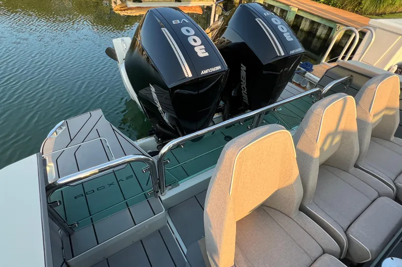 Slide: The Image of 2023 Saxdor 320 GTO boat with twin Mercury 300 engines and comfortable seating. - 16