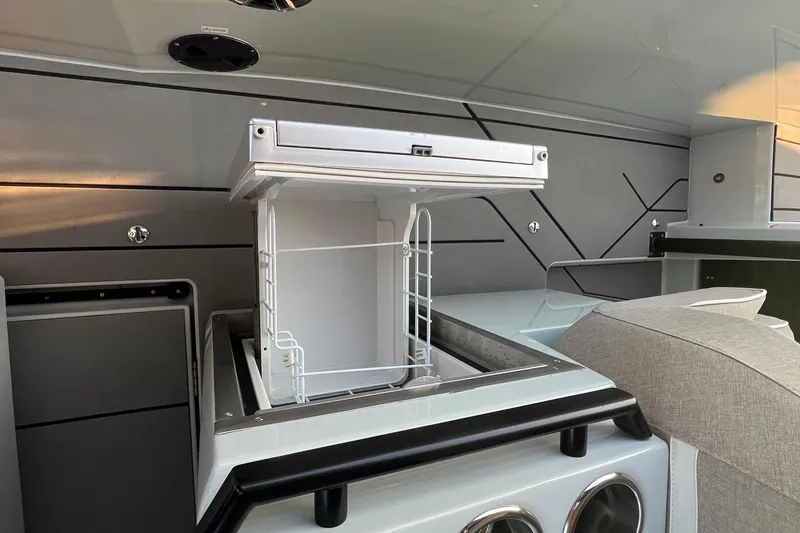 Slide: The Image of 2023 Saxdor 320 GTO interior with open storage compartment and modern design. - 21