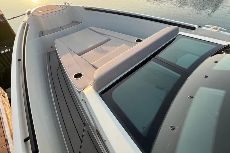 Slide: The Image of 2023 Saxdor 320 GTO boat deck with sunbed and sleek design at sunset. - 40