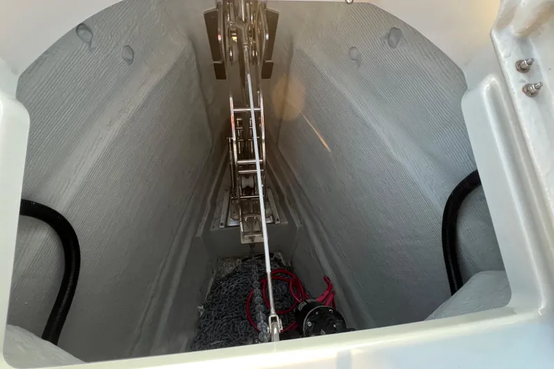 Slide: The Image of Anchor compartment of 2023 Saxdor 320 GTO boat, featuring chain and winch system. - 41
