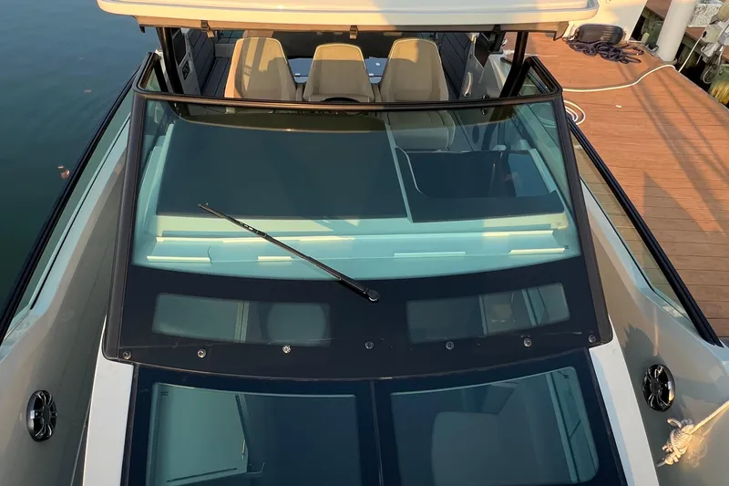 Slide: The Image of 2023 Saxdor 320 GTO boat, top view of windshield and seating area. - 46