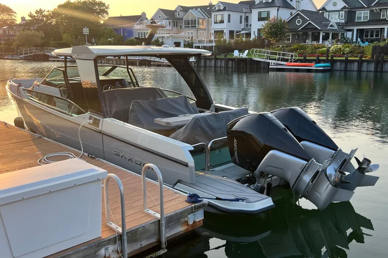 Slide: The Image of 2023 Saxdor 320 GTO docked by waterfront homes at sunset. - 53
