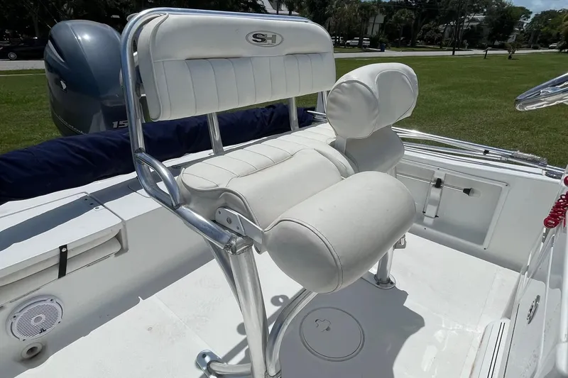 Slide: The Image of 2019 Sea Hunt BX 20 BR boat with white cushioned seating and stainless steel frame. - 12