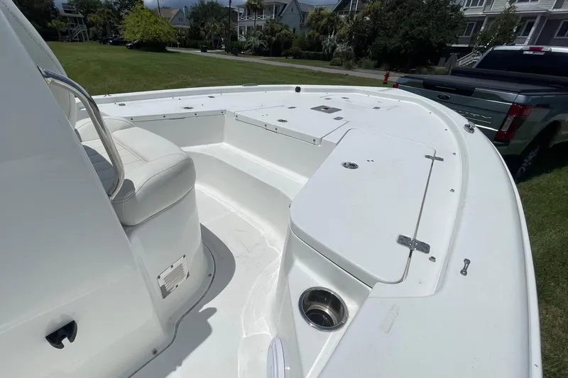 Slide: The Image of 2019 Sea Hunt BX 20 BR boat interior with seating and storage compartments. - 13