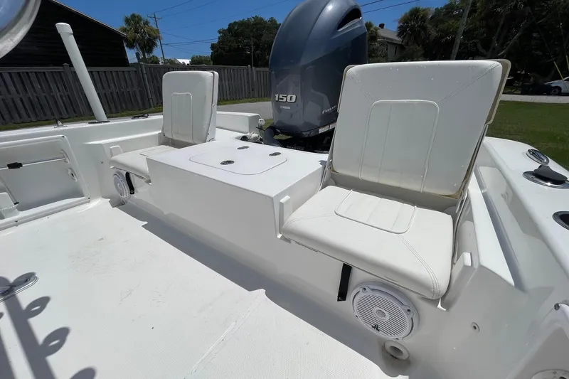Slide: The Image of 2019 Sea Hunt BX 20 BR boat interior with seating and Yamaha 150 engine. - 16