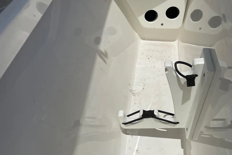 Slide: The Image of Interior of a 2019 Sea Hunt BX 20 BR boat, featuring storage compartment details. - 19
