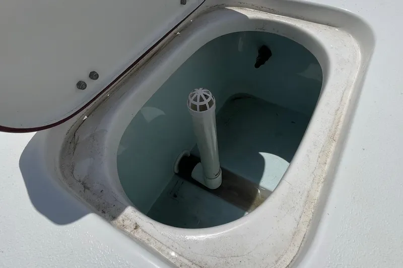 Slide: The Image of Open storage compartment on 2019 Sea Hunt BX 20 BR boat. - 21